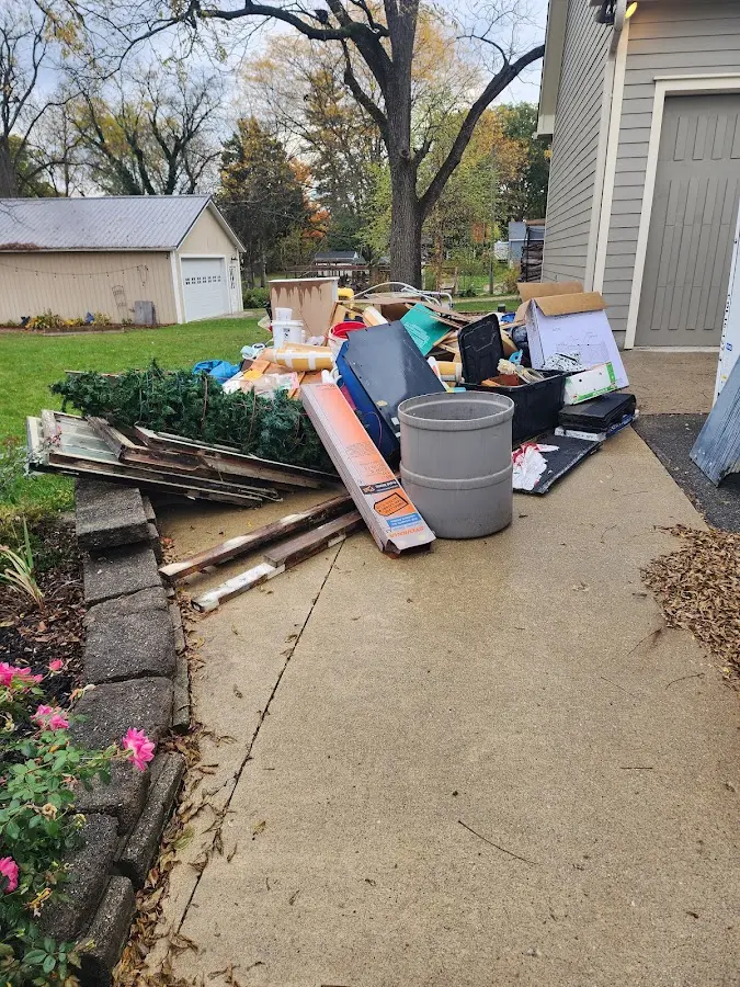 Dumpster being loaded with debris for 10 Yard Dumpster Rental in Pharr